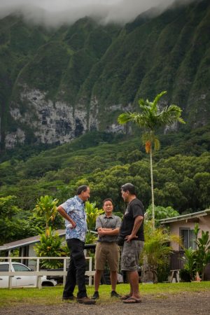 Three men talking Waimanalo Internet