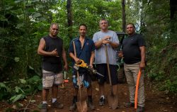 Four men with tools building a community network in Hawaii