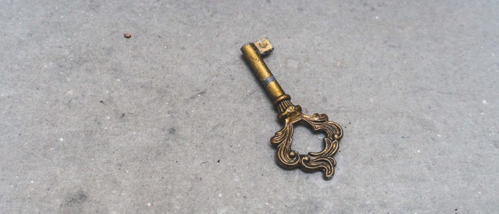 a golden key on a floor