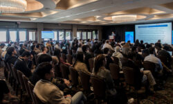 a crowd of people in a NDSS 2020 session