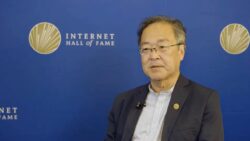 Tadao Takahashi with Internet Hall of Fame logo in background