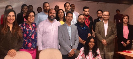 a group of people smiling at camera