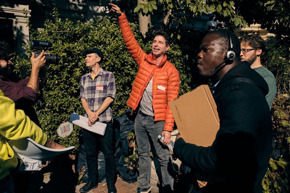 a group of people talking outdoors