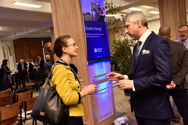 two people talking at an event during a break