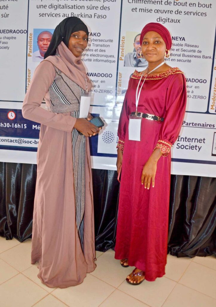 Two women in traditional dress standing side by side