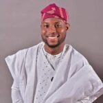 a man wearing traditional clothes smiling