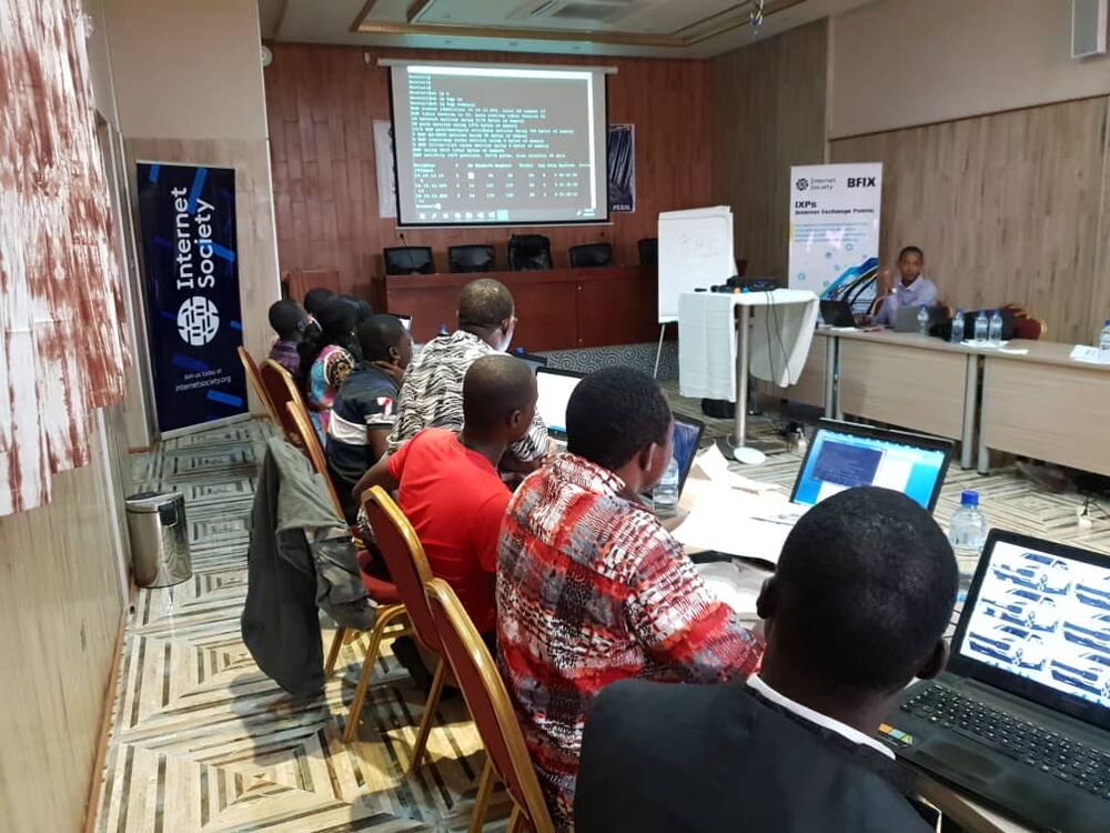 Several people sit at a Burkina Faso IXP (BFIX) workshop