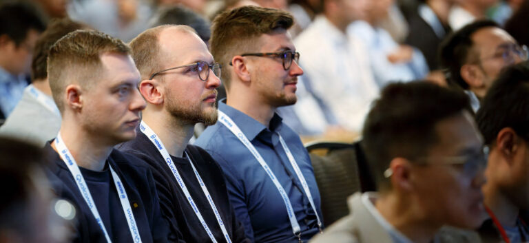 People sit in the audience at NDSS and watch intently