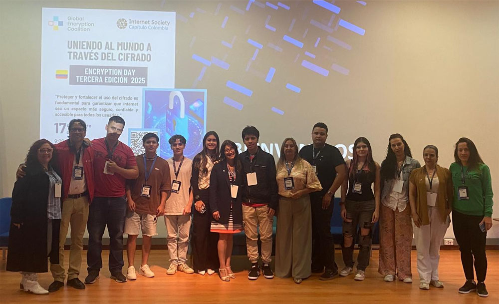 A group of people stand together at a Colombia Chapter encryption event