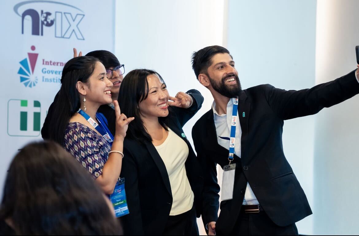 people taking selfie at an event