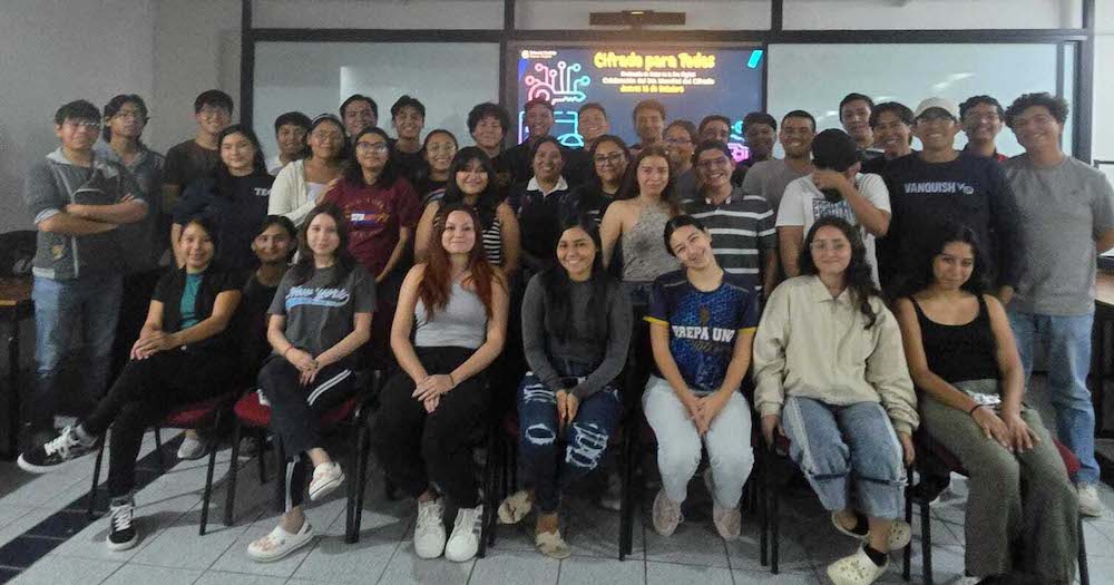 A group of people sit and stand together at an Internet society Mexico Chapter Global Encryption Day event