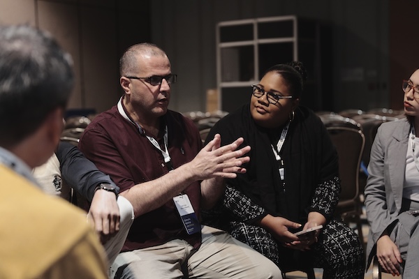 a diverse group of people engaged into conversation