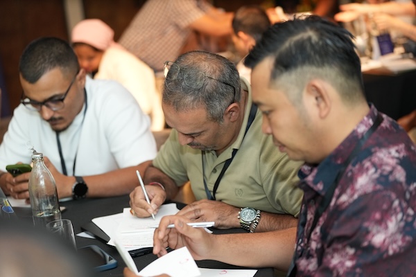 a group of people writing