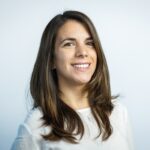 A woman in white blouse smiling