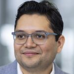 A man in a grey suit