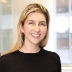 A woman in black shirt smiling