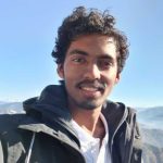 A man in a black hoodie