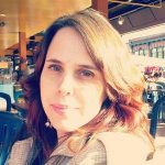 A woman in a plaid jacket.