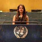 A woman stands at the United Nations podium.