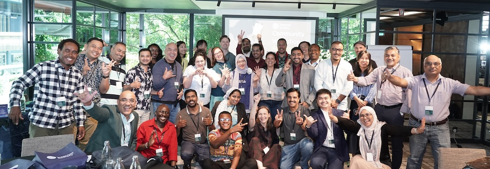 A group of people smiling and posing for a photo