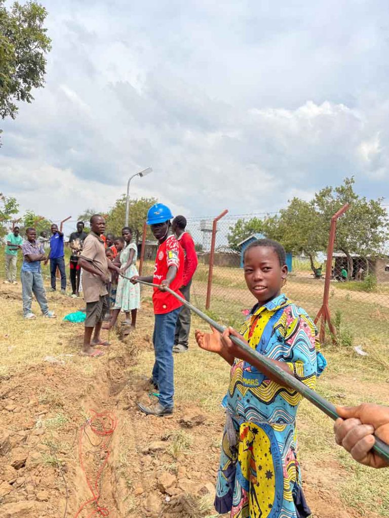 Community members come together to help Hello World build an Internet hub in the Siripi zone.
