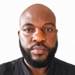 A man with a beard wearing a black shirt