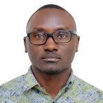 A man with glasses wearing a patterned shirt