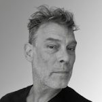 A man with a beard wearing a black shirt