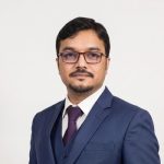 A man wearing a suit and tie.